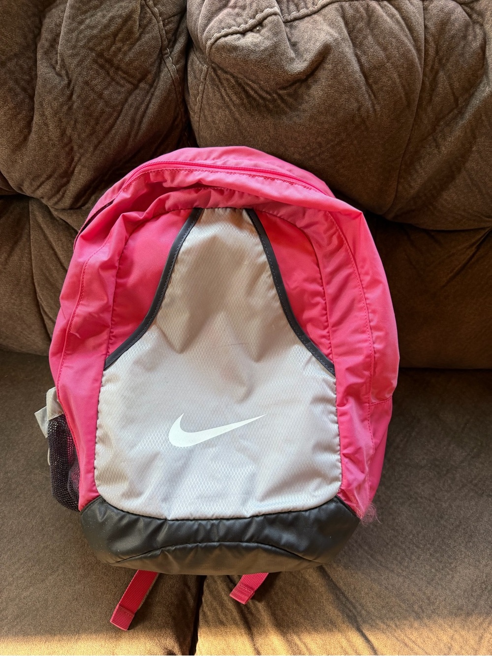 Pink and grey Nike backpack